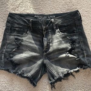 Distressed black mid-rise super stretch shorts